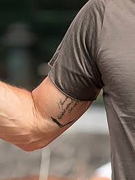 Brad pitt seemingly unveils mysterious new tattoo next to his angelina jolie ink. Brad Pitt Debuts New Tattoo On Arm Near Angelina Jolie Matching Ink Hollywood Life