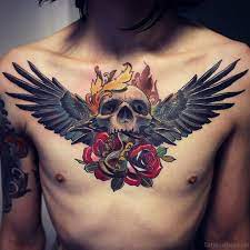 Skull And Wings Tattoo On Chest Wings Tattoo Neck Tattoo Tattoos For Guys