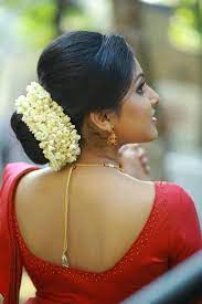 What A Beautiful Large Low Bun With Flower Gajra Care However Should Be Taken Before Adopting Such Hairstyles As Due T Bridal Hair Buns Hairdo Bridal Hairdo