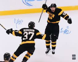 Patrice bergeron looks out the window of the train. Patrice Bergeron Brad Marchand Signed Boston Bruins 16x20 Photo Bergeron Marchand Coa