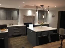 White backsplash with gray kitchen cabinets. Colour Schemes For A South Facing Kitchen Rock And Co Granite Ltd