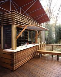 This Is A A Relatively Modest Small Wooden Summer House But Its Inventive Construction Provides Endless Pl Wooden Summer House Backyard Bar Summer House Garden