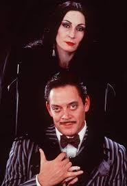 The Heads Of The Family Morticia Addams Played By The Great Anjelica Houston And Gomez Addams Pl Addams Family Costumes Addams Family Addams Family Movie