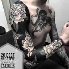 Black And White Space Tattoos For Men 20 Best Negative Space Tattoos For Men Floral Tattoo Sleeve Tattoo Styles White Flower Tattoos