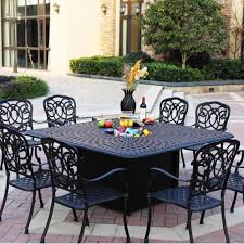 A rounded fire pit table makes your outdoor space look prettier. Darlee Florence 9 Piece Cast Aluminum Patio Fire Pit Dining Set Dining Table With Ice Bucket Insert Mocha Bbqguys