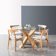 Even the base under the round scandinavian dining tables can be characterized by a particularly creative design. Solid Wood Round Dining Tables Oscar Icon By Design