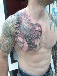 30 Awesome Dragon Tattoo Designs Cuded Dragon Tattoo Cool Chest Tattoos Tribal Shoulder Tattoos