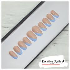 This is a gorgeous and simple design that does make a statement. Light Blue Striped French V Tip Press On False Nails Creative Nails