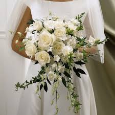 Small white flowers used in wedding bouquets. White Rose Handheld Wedding Bouquet At Send Flowers