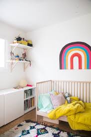 My son started in a toddler bed when he was around 2 years old and he went to a big bed at around age 5 once it didn't take with my older so he was back in a crib til 2 1/2 and only in the toddler bed til 4. Children S Bedrooms From Toddler To Big Kid Bed Hither Thither