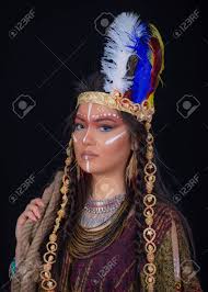 A feather could be a symbol of trust, honor, strength, wisdom, power, freedom and many more things. Close Up Portrait Of Shamanic Female With Indian Feather Hat And Colorful Makeup Native American Indian Woman In Traditional Dress Stock Photo Picture And Royalty Free Image Image 147988649