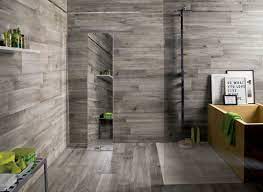 You'll just need to check the tiles you choose are suitable for wet conditions on walls and underfoot. Dark Grey Wooden Floor And Wall Tiled Room With Green Accents In Large Bathroom Ideas Holzfliesen Dusche Holzwand Fliesen Badezimmer Renovieren