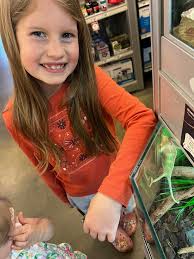 In nature and at PetSmart, she is the little animal whisperer!! The  chameleon nearly came home with us!! We are raising the Eastern Tent  caterpillars we found in our yard in the