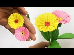 This project is a simple twist on a pom pom garland by stringing them. How To Make Small Paper Flower Making Paper Flowers Step By Step Diy Paper Crafts