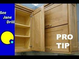 A process that involves plywood side panels to perfectly interlock with a solid wood face frame through corresponding dovetail grooves. Don T Make This Rookie Mistake When Hanging Kitchen Cabinets Youtube