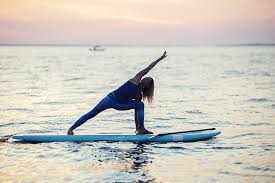 Standup Paddle Yoga 101 A Beginner S Sequence To Start Your Practice Paddle Board Yoga Yoga Standup Paddle