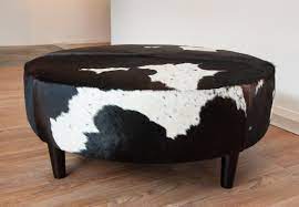 Featuring a tufted velvet body with a tempered glass top, perfect to use as a stylish ottoman or coffee table. Animal Print Ottoman Cowhide Ottoman Round Ottoman Round Ottoman Coffee Table