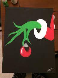 The finished product will be. Painted Grinch Hand Holding An Ornament Diy Christmas Canvas Diy Christmas Paintings Christmas Paintings On Canvas