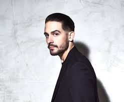 Playing the 70`s game male character leather jacket, cigarette behind ear and in mout one name starting with a k 8 letters. Good Quality Photo G Eazy Music Singer