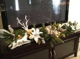 Going To Attempt To Make Something Like This Minus The Deer Statue Tv Stand Christmas Decor Xmas Decorations Christmas Table Decorations