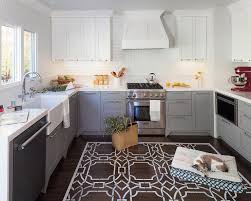 Going into 2021, wood stained kitchen cabinets will still be popular in more traditional kitchens. White Upper Cabinets And Gray Lower Cabinets Transitional Kitchen