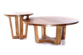 A coffee table is a low table designed to be placed in a sitting area for convenient support of beverages, remote controls, magazines, books (especially large, illustrated coffee table books), decorative objects, and other small items. Maison Round Coffee Table Urban Rhythm