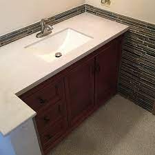 Beautiful shower with zellige tile from zia tile, slab jams and corner to match ocunter top. Tile Wainscoting Cap And Molding Ideas To Complete Your Bathroom Trubuild Construction