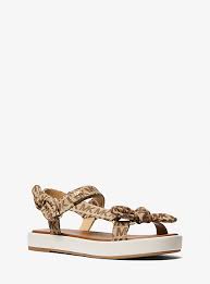 Shop the official michael kors germany online shop for jet set luxury: Phoebe Logo Jacquard Bow Sandal Michael Kors