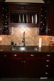 Lovely monochromatic european kitchen design with gray kitchen cabinets, gray walls paint color, ubatuba granite counter tops, sink in kitchen island, farmhouse sink and open shelves. 62 Best Uba Tuba Granite Ideas Uba Tuba Granite Kitchen Remodel Uba