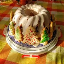Pound cake has been around for hundreds of years, and is originally named for its ingredients, as the cake called for a pound each of eggs, granulated sugar, butter, and all purpose flour. Our Christmas Pound Cake Complete With As Many Sugar Cookie Trees As We Can Fit Around It Christmas