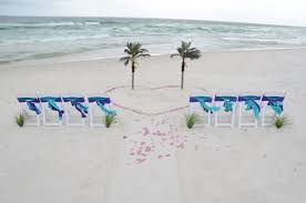 Simple Beach Set Up Palm Trees In A Heart Of Rose Petals Panama City Beach Florida Destina Beach Destination Wedding Beach Wedding Decorations Beach Wedding