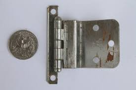 Decorative hinges—like the hammered brass examples here—were popular on cabinet doors for decades. Vintage Deco Chrome Hinges Kitchen Cabinet Hardware Cupboard Door Hinges