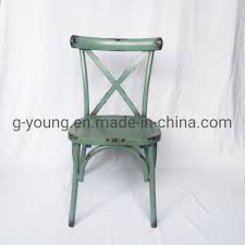 Ours are designed with the right proportions to be comfortable to sit in until dessert. China Vintage Stackable Wooden Like Metal Cross Back Dining Chair China Chair Furniture
