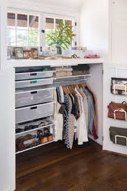 Maximizing vertical space, with the use of hangers such as these, is a great way to make the most of small closet organization systems within petite spaces. Elfa Custom Closet Shelving Solutions Clothes Organization Small Space Custom Closet Shelving Small Space Organization