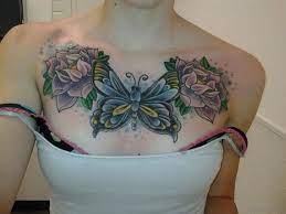 In this tattoo, there are two roses and one of the rose has a hand holding an envelope with a letter. Butterfly Tattoo On Chest Women Novocom Top