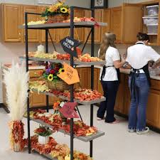Floral Design students Andria Lab, Destiny Walkins, and Emily DeVecka are  hard at work crafting beautiful boutonnieres and corsages for homecoming!  We can't wait to see these stunning pieces worn to area