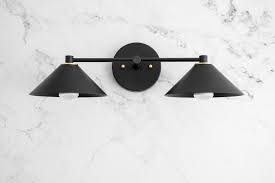 Aptly named for a musical term that calls the munich vanity light by troy lighting is glossy, glamorous and geometric lighting for the modern bathroom. Black Vanity Light Art Deco Deco Bathroom Geometric Etsy Modern Vanity Lighting Black Vanity Light Modern Bathroom Lighting