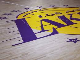 For a secondary logo i isolated the la letters to create a lockup similar to the popular dodgers logo Lakers Staples Center Floor Celebrates 16 Championships