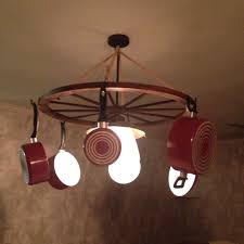 Used Wagon Wheel To Create A Pot Pan Holder For Kitchen Kitchen Style Diy Pots Pan Hanger