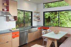 A palette of black and white with wood and metal accents looks sleek and modern in the kitchen. 6 Ways To Refresh Your Kitchen On A Budget Modernize