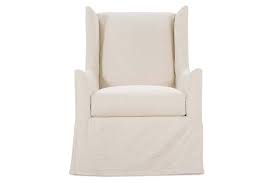You have a slipcover for your couch. Della Tall Wing Back Swivel Glider Slipcovered Accent Chair With Slopi