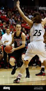 Louisville guard Megan Deines (15) drives against Cincinnati guard Chelsea  Jamison (25) during the second half