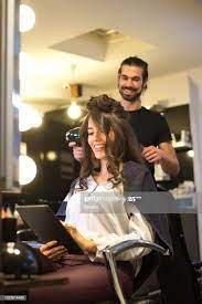 Young Woman Getting New Hairstyle In The Modern Hair Salon Modern Hairstyles Hair Salon Elf Hair