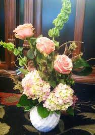 Flower Arrangement With Geraldine Roses Bells Of Ireland Hydrangea Moss Sticks Aspidistra Leaves Made For The Flower Arrangements Flower Delivery Flowers