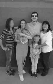 Jodi Arias Holds New Infant Nephew In Prison Photo