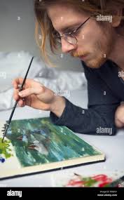 Painting man bed Banque de photographies et d'images à haute résolution