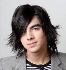 The sideburns and neck are neatly trimmed, while the bangs are left alone. Men S Long Hairstyles Stylespedia Com
