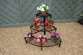What can i put inside after decorated? Wonderful Wrought Iron Flower Pot Stands Decor Inspirator