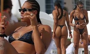 Basketball star Liz Cambage shows off phenomenal figure in a string bikini  | Daily Mail Online