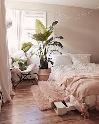 A perfect display of boho chic bedroom decor with a combination of colourful cushions, patterned comfort, wall decor and plantation. How To Create The Perfect Boho Chic Bedroom Posh Pennies